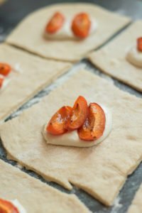 three roasted apricot quarters on a filling of curd cheese.